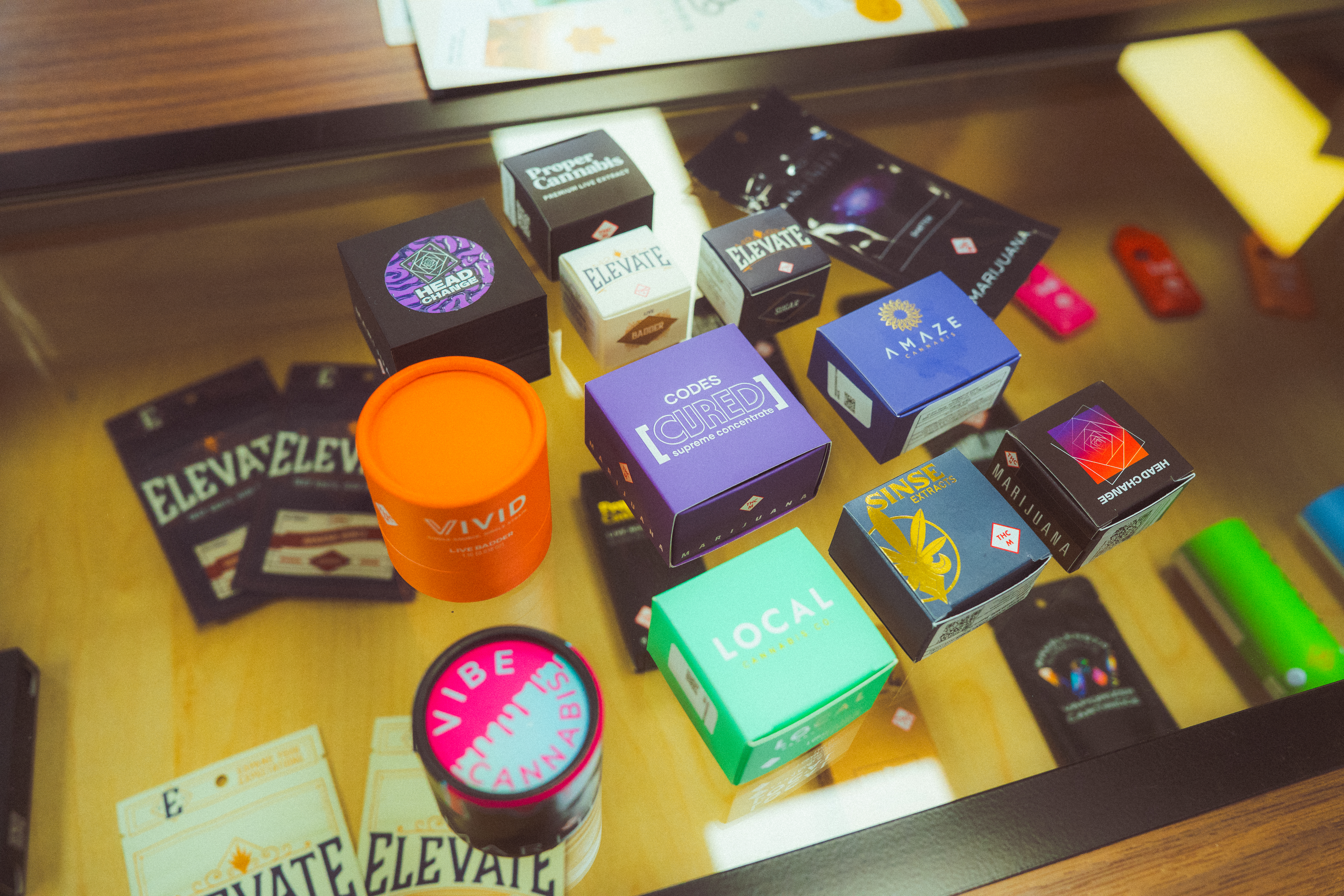cannabis concentrates on top of a glass display case